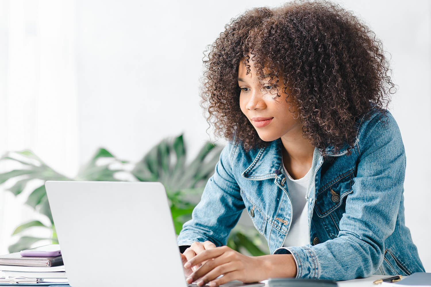 woman typing on her laptop